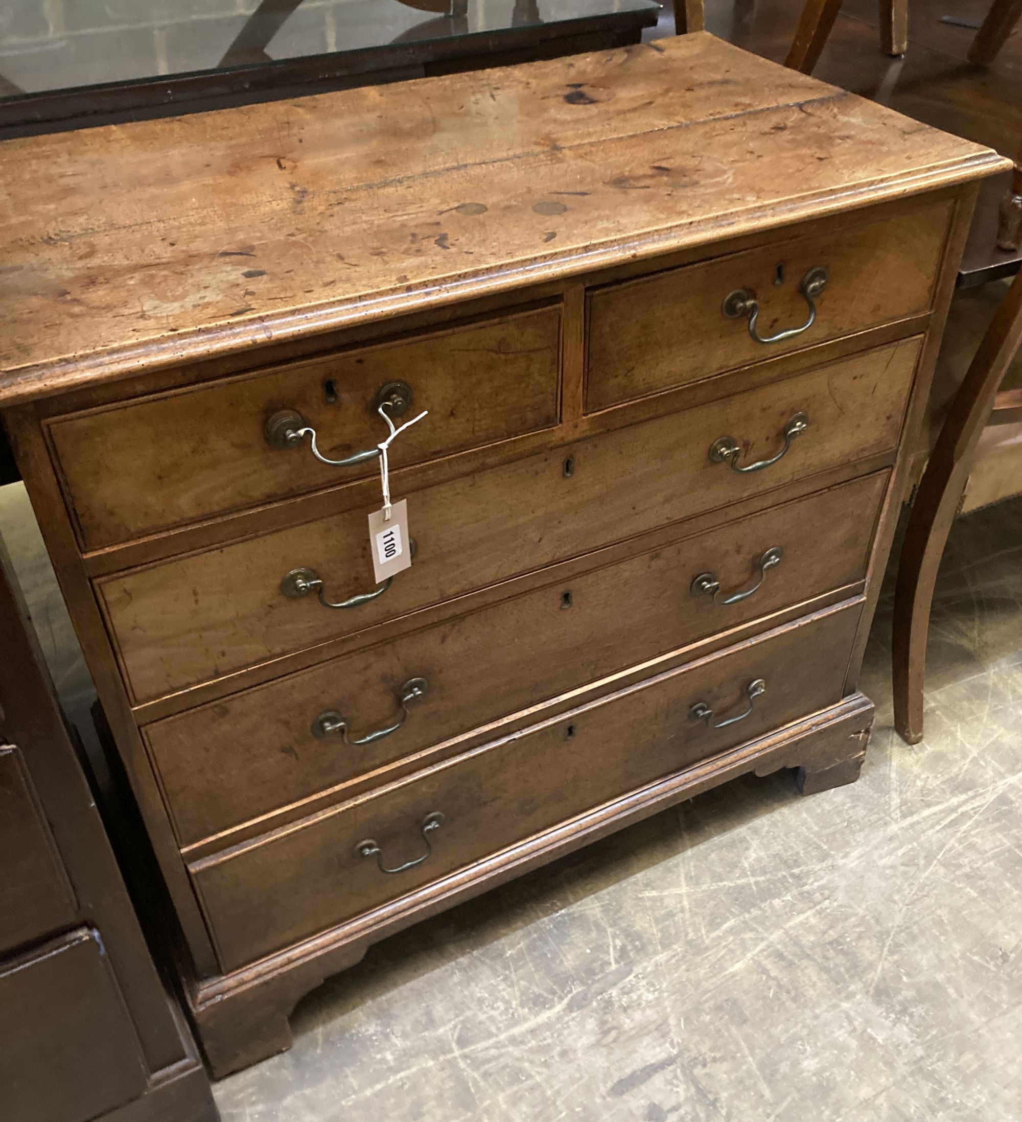 A George II fruitwood chest of two short and three long drawers, with brass drop handles, on bracket feet, width 90cm, depth 47cm, heig